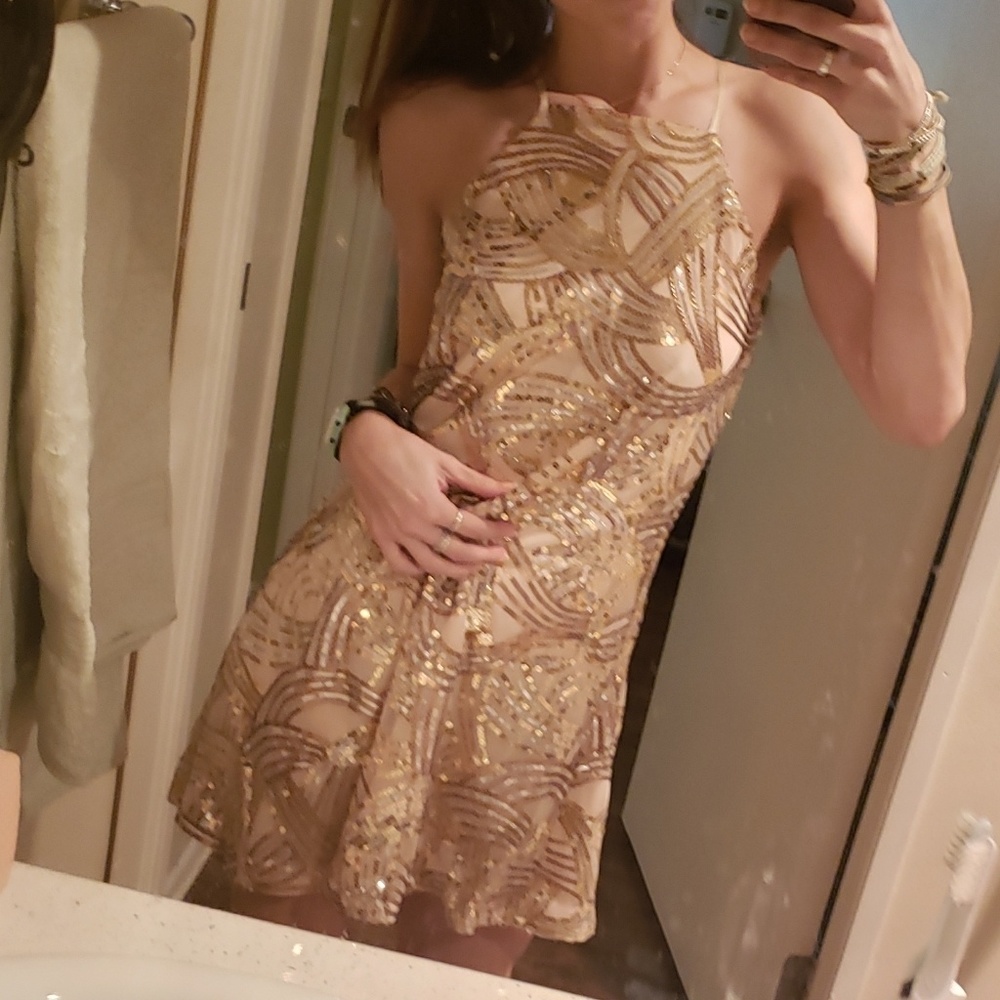 Champagne sequined sleeveless dress.